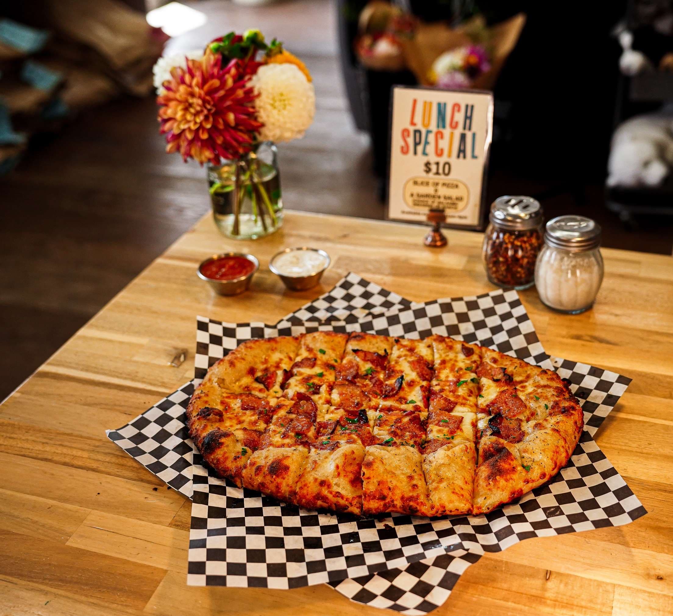 Cheeseburger Pizza with burger sauce base, hamburger meat, mozzarella, cheddar, red onion, and pickle