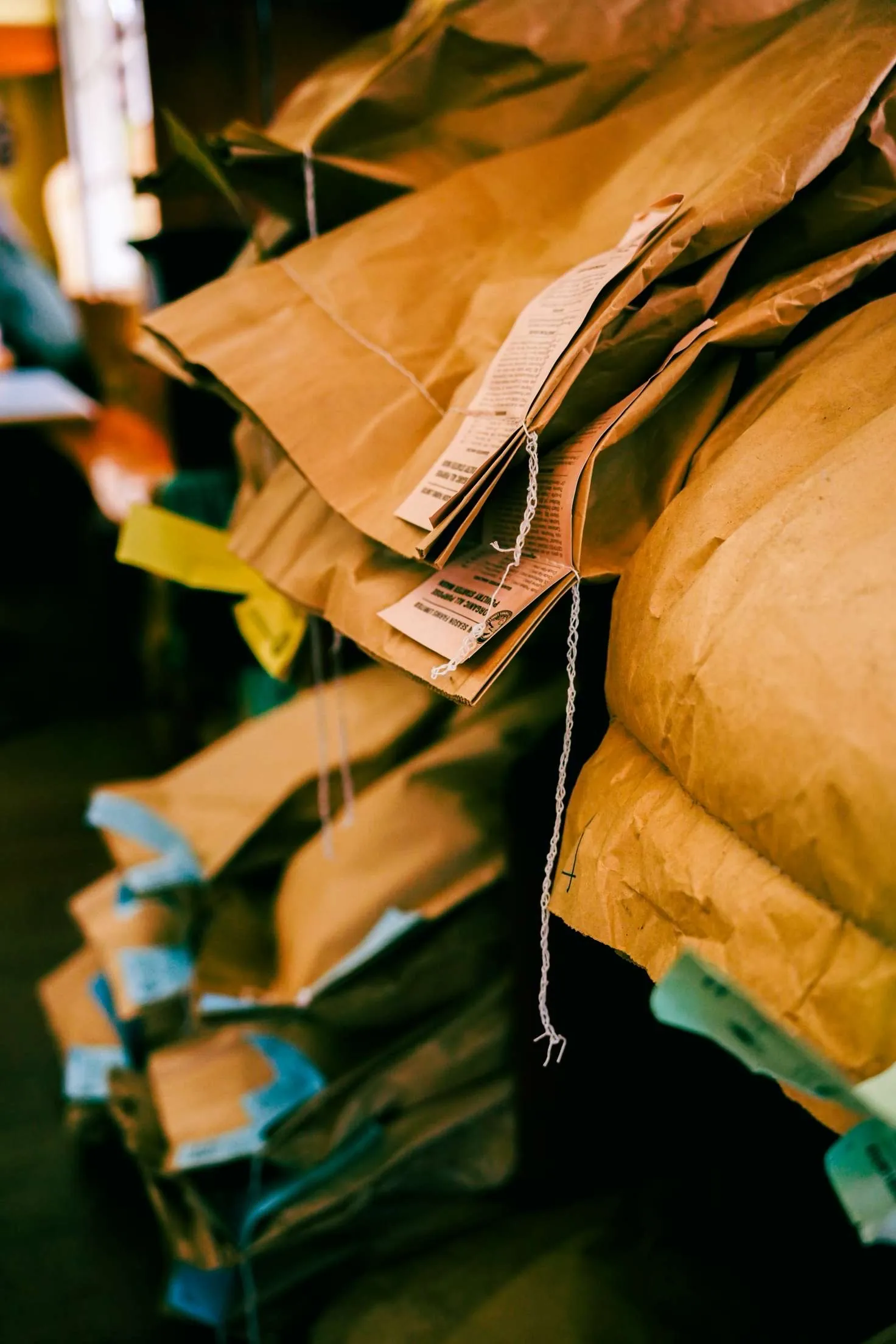 Bags of animal feed on a retail shelf.