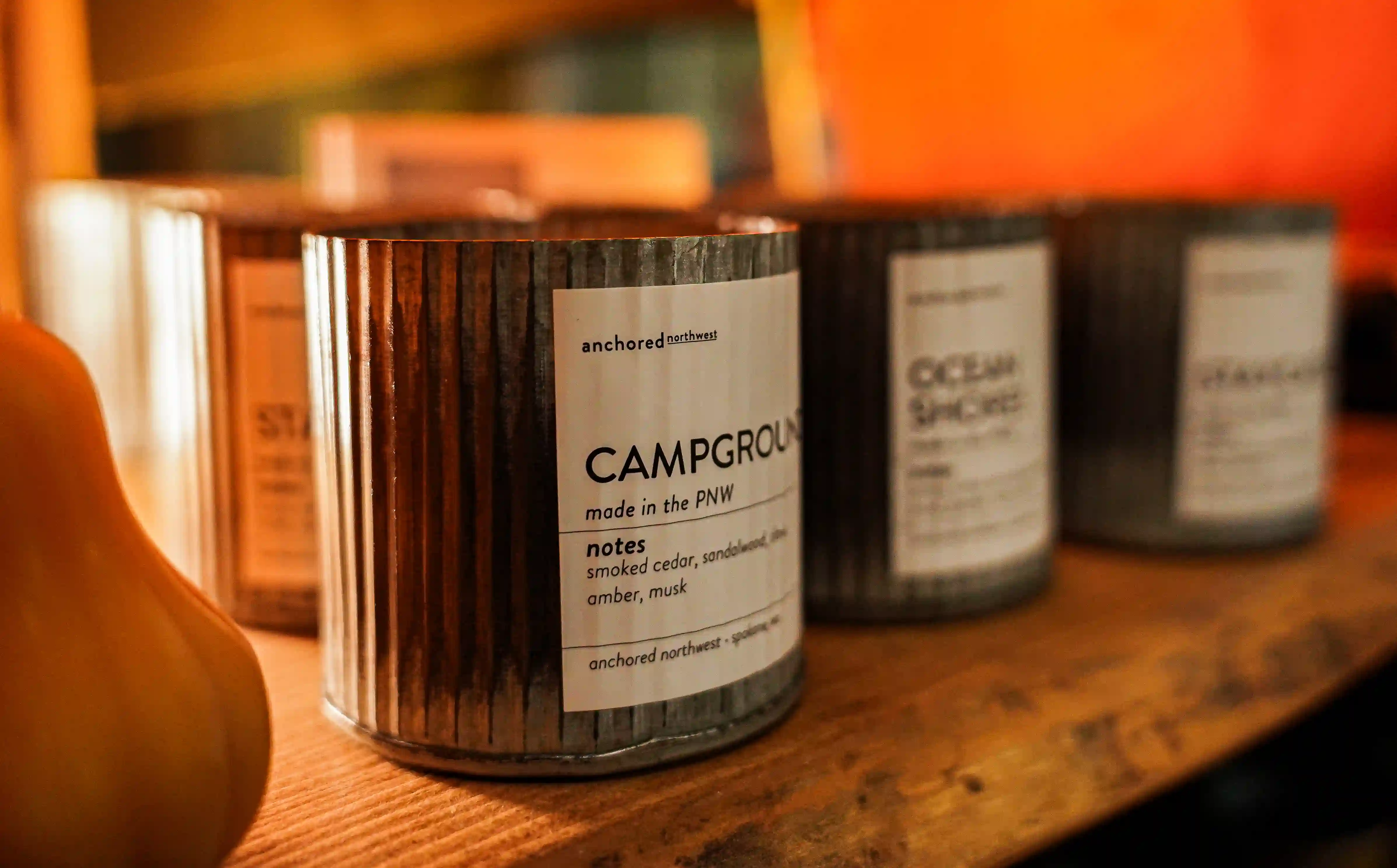 Candles on a retail shelf from Anchored Northwest.