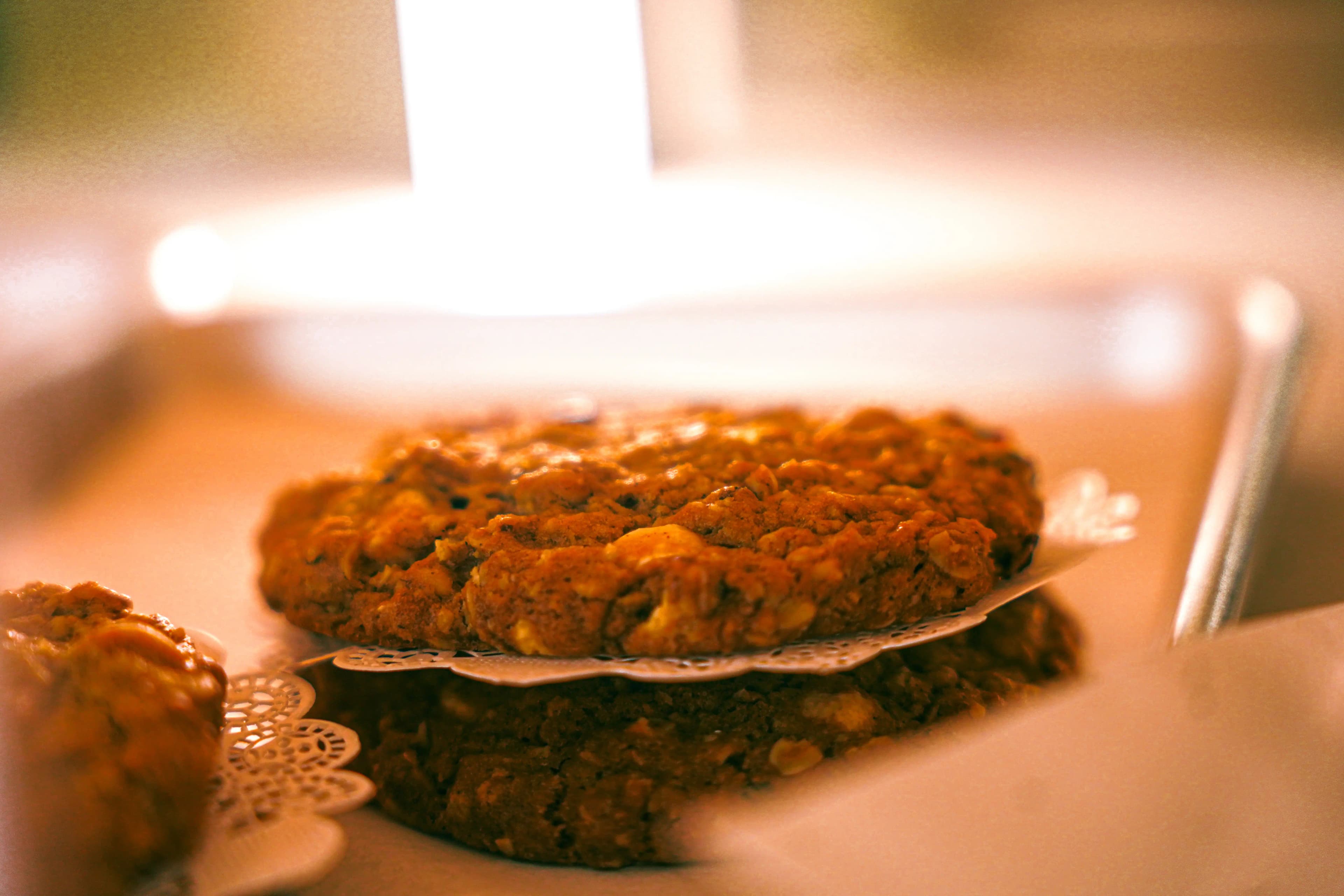 Assortment of large cookies displayed in a pastry case