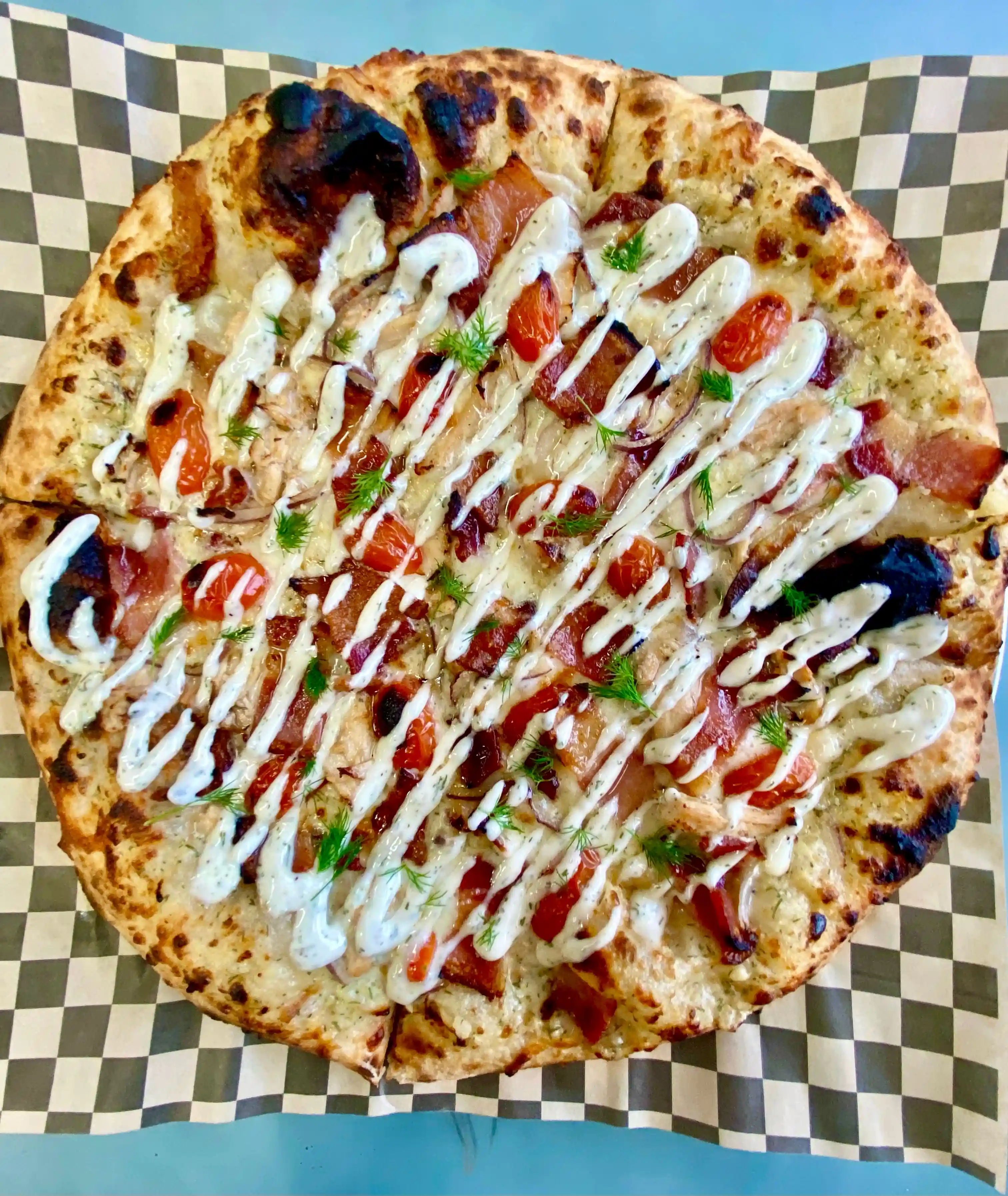 Topdown view of a Chicken Bacon Ranch pizza